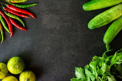 High angle view of chili peppers on black background