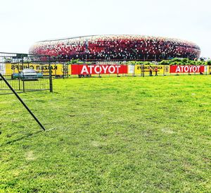 Text on field against clear sky