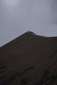 Low angle view of desert against sky