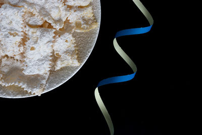 High angle view of ice cream against black background