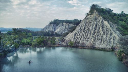 Scenic view of mountain against cloudy sky