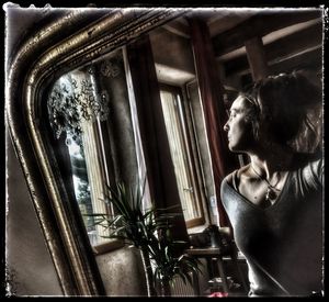Statue looking through window