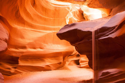 Sand flowing from rock at upper antelope canyon navajo tribal park arizona