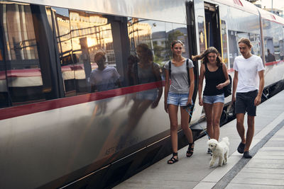 Friends on train station