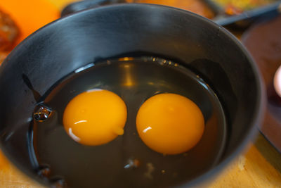 High angle view of egg in container on table