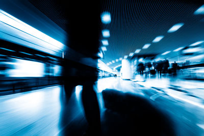 Blurred motion of illuminated subway station