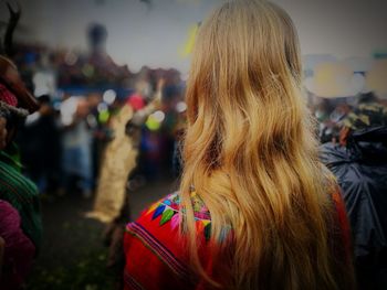 Rear view of woman standing outdoors