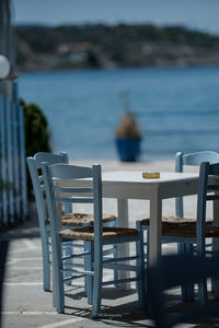 Rear view of woman on table at sea