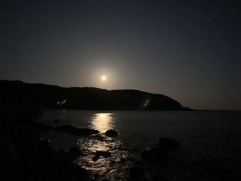 Scenic view of sea against sky at night