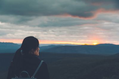 Scenic view of landscape against cloudy sky