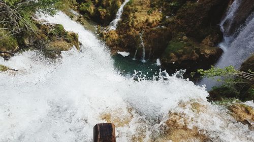 Water splashing on rocks by sea