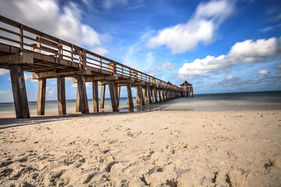 View of pier over sea against sky