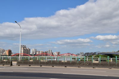 View of bridge against cloudy sky