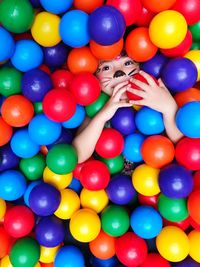 Directly above portrait of girl in ball pool