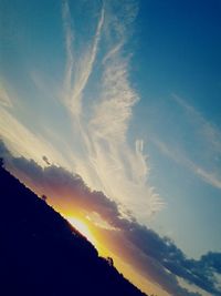 Scenic view of landscape against sky at sunset