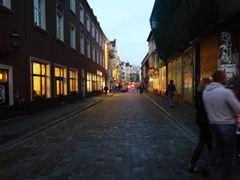 People walking on street in city