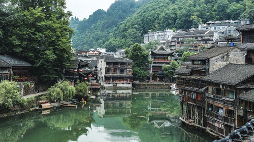 River amidst buildings and trees