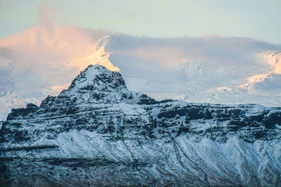 Scenic view of snowcapped mountain against sky during sunset