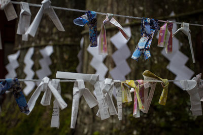 Close-up of padlocks hanging on rope