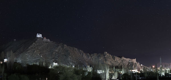 Panoramic view of illuminated buildings in city at night