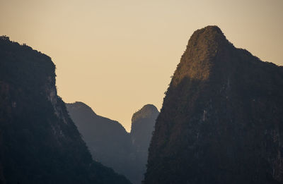 Low angle view of mountains against sky during sunset