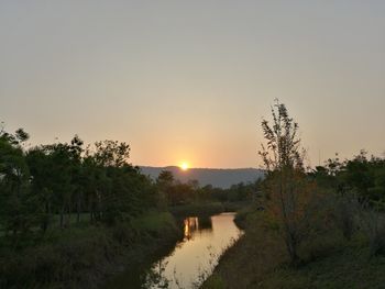 Scenic view of silhouette landscape against clear sky during sunset