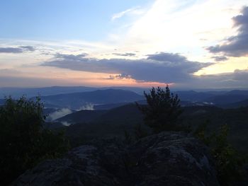 Scenic view of mountains against sky at sunset