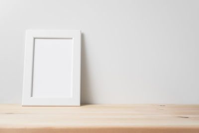 White wooden table against wall at home