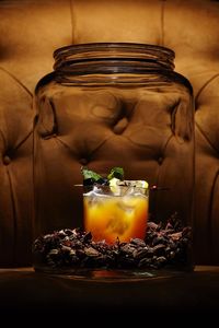 Close-up of drink in glass jar on table