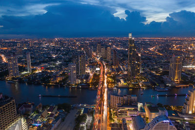 High angle view of illuminated buildings in city at night