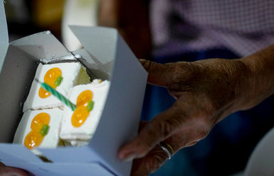 High angle view of man holding food