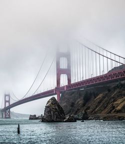 Suspension bridge over river in city