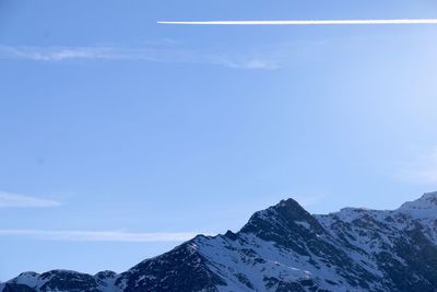 Scenic view of mountains against cloudy sky