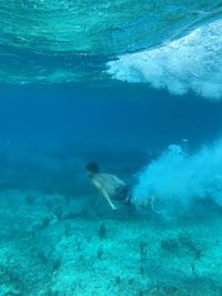 Man swimming in sea