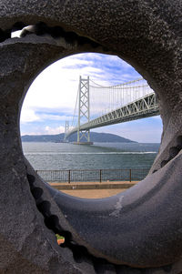 Bridge over sea against sky