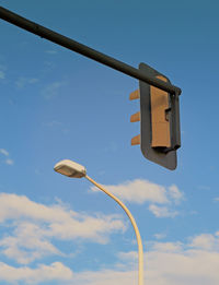 Low angle view of back traffic lights against sky