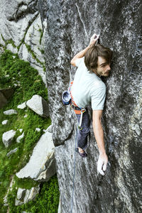 High angle view of man rock climbing