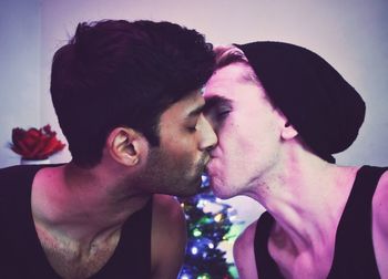 Close-up of gay couple kissing