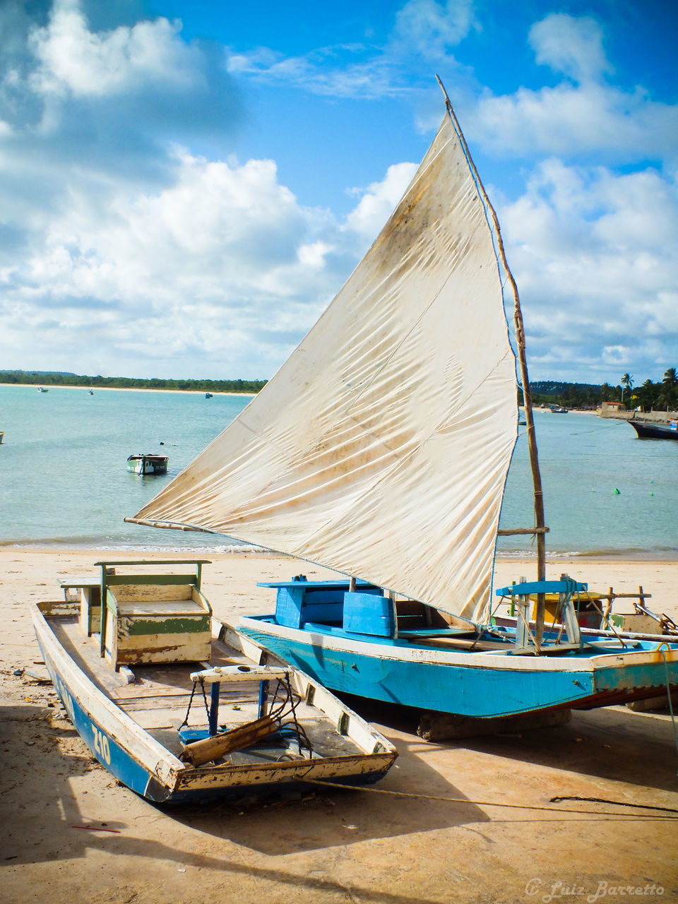 BOATS MOORED ON SEA