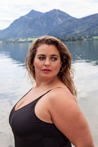 Portrait of young woman in lake