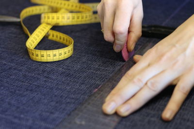 Cropped image of dressmaker at work