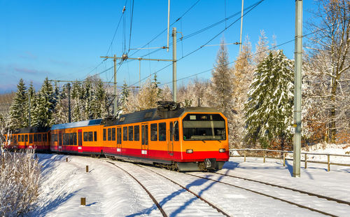 Train on railroad track against sky