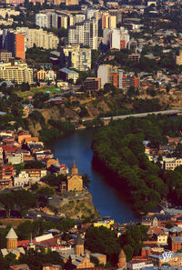 High angle view of river amidst buildings in city