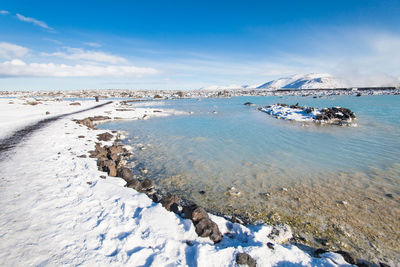 Scenic view of sea against sky during winter