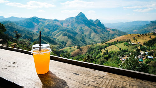 Fresh orange juice with the greenery scenic view. mae hong son, thailand.