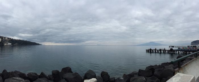 Scenic view of sea against cloudy sky
