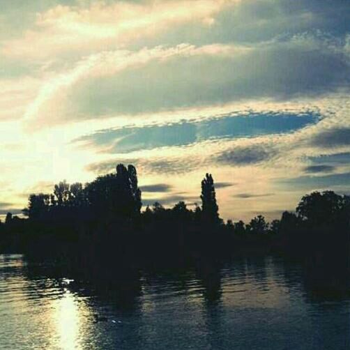 water, sky, silhouette, waterfront, tree, tranquil scene, tranquility, scenics, beauty in nature, sunset, lake, cloud - sky, nature, reflection, idyllic, cloud, river, rippled, outdoors, cloudy