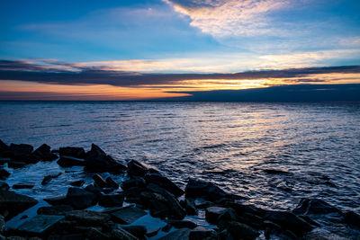 Scenic view of sea against sky during sunset