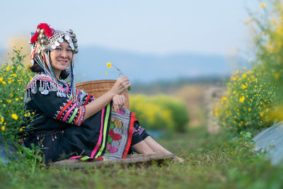 Woman sitting on field