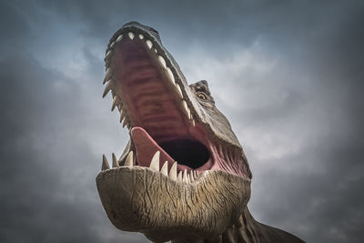 Low angle view of statue against sky